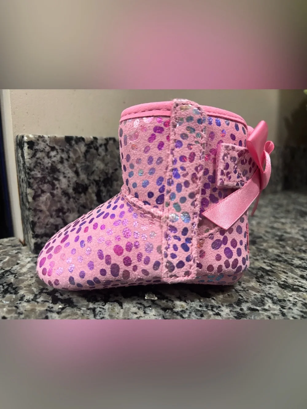UGG Jesse Bow Metallic Rainbow Polka Dot Baby Bootie in Pink Rose Suede Plush